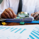 An Auditor Reviewing Documents with a Magnifying Glass